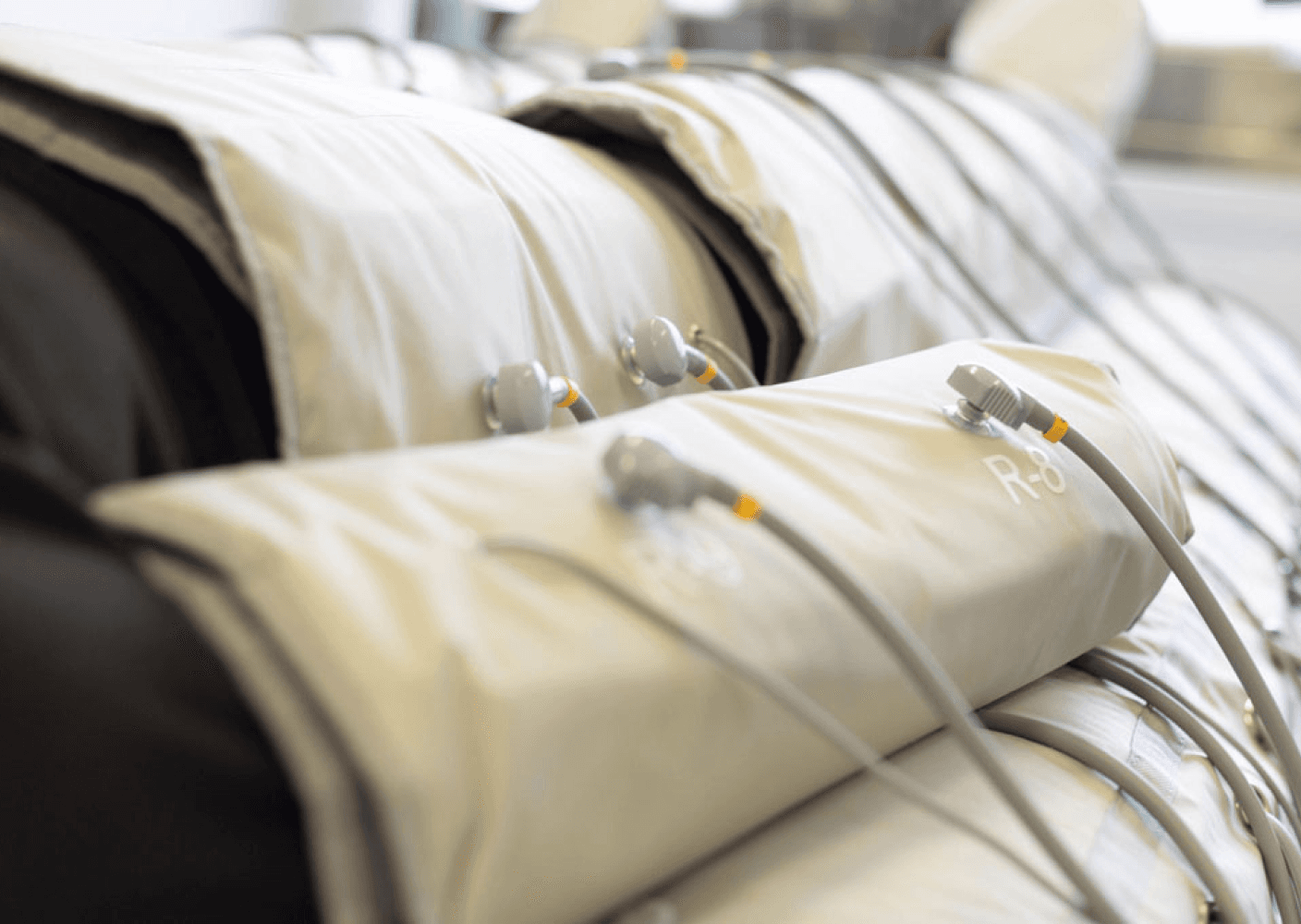 Photo of compression therapy equipment with multiple attachments in a clinical setting.