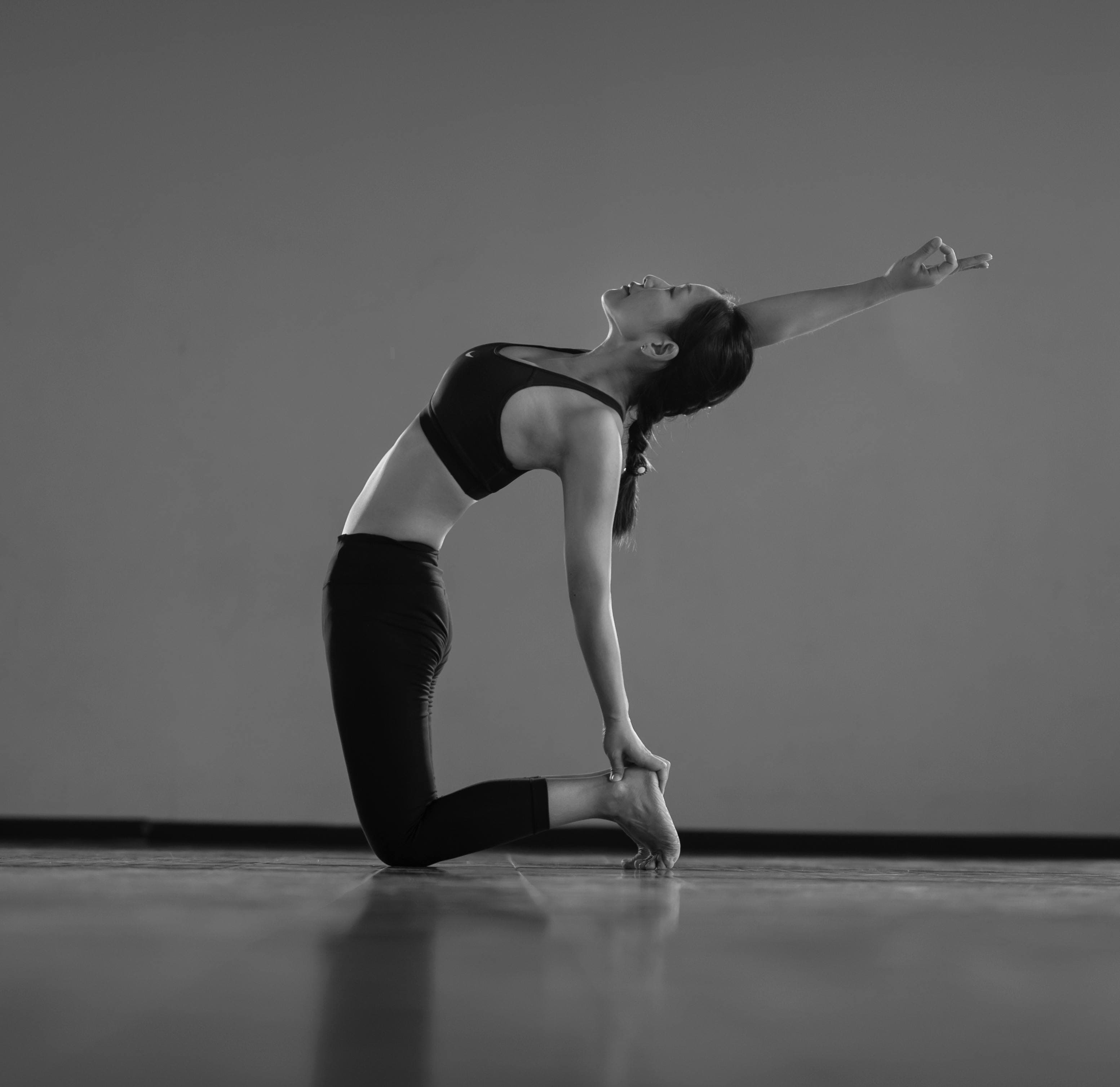 a close up image a woman doing a pilates pose