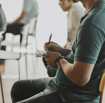 A person writing notes