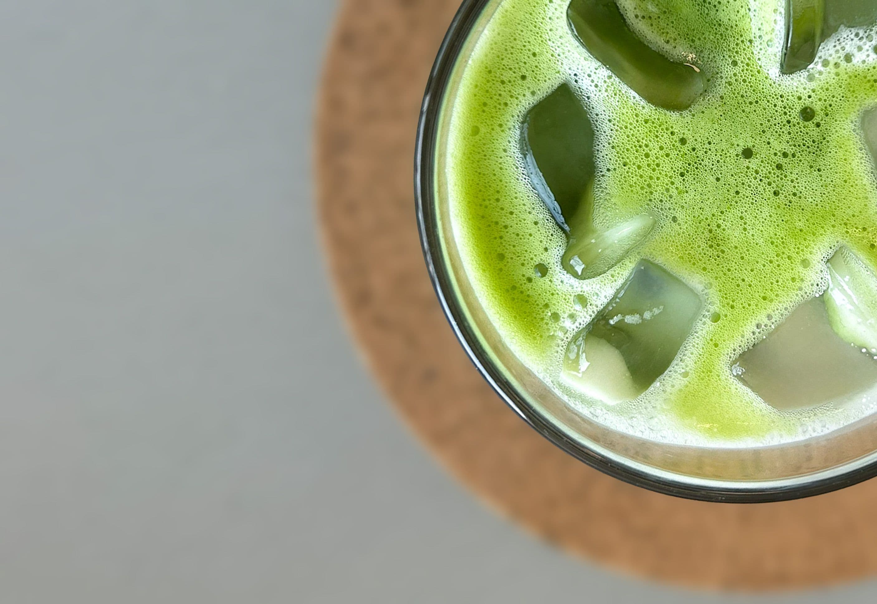 glass with iced matcha latte